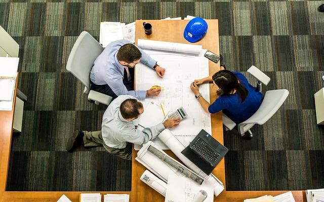 diverse group of professionals in a modern office meeting discussing career growth