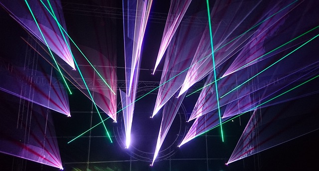 person using a laser distance meter to measure a large room's dimensions (how do you measure square feet)