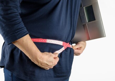 woman measuring body tape