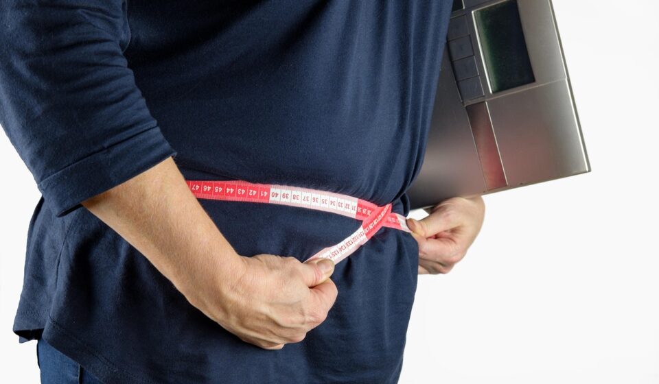 woman measuring body tape